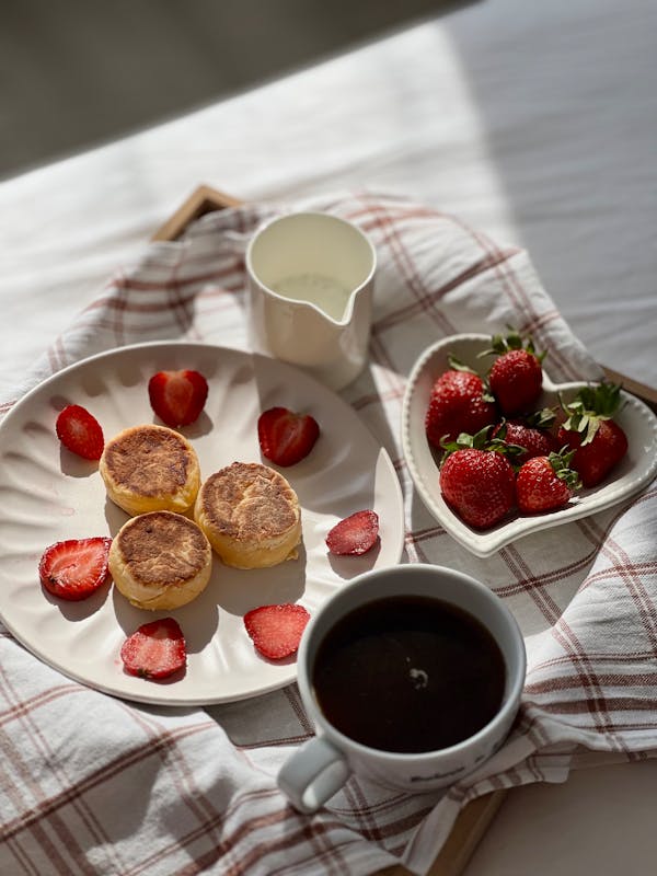 free photo of a breakfast tray with pancakes strawberries and coffee 2